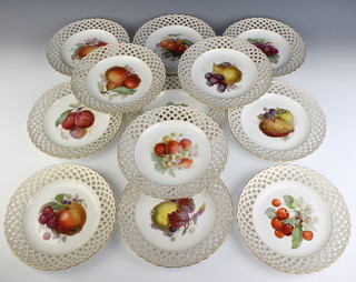 A set of 12 KPM dessert plates with pierced rims enclosing panels of fruits 22cm