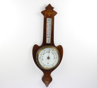 An Edwardian Art Nouveau aneroid barometer and thermometer with porcelain dial contained in an inlaid mahogany wheel case 