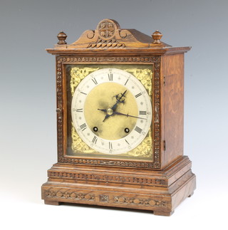 A striking bracket clock with gilt dial, silvered chapter ring contained in an oak case, the back plate marked W & H SCH 