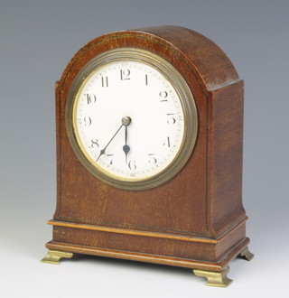 An Edwardian French bedroom timepiece with enamelled dial and Arabic numerals contained in an arched inlaid mahogany case (glass f and missing) 
