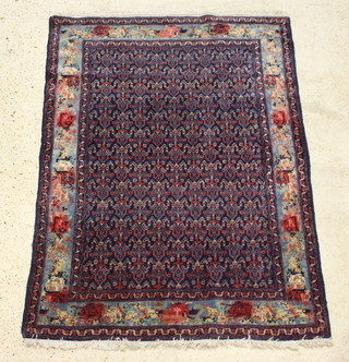 A Persian blue and red ground Senneh rug within multi row border 160cm x 110cm 