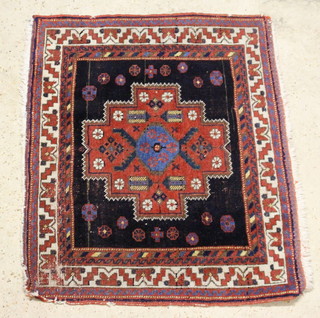 A brown, red and white ground Persian Afshar rug with medallion to the centre within a multi row border 86cm x 69cm