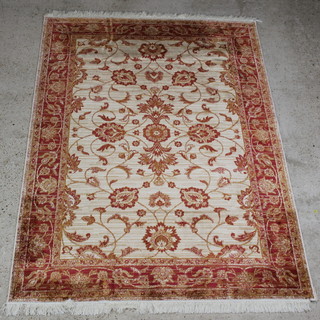 A gold ground and floral patterned Ziegler style Belgian cotton rug 230cm x 160cm  