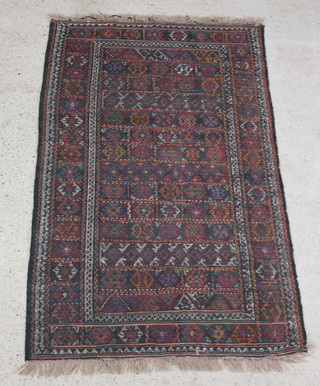 A multi coloured ground Afghan Kilim style rug, the central panel formed of numerous squares 176cm x 103cm 