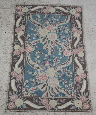 A green and white ground Aubusson style Kashmiri wool panel with floral decoration 140cm x 81cm 