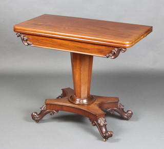 A William IV rectangular mahogany D shaped tea table with shaped apron, raised on a chamfered column and triform base with scrolled feet 76cm x 90cm x 45cm