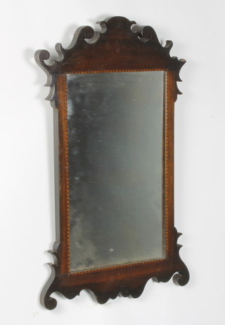 A 19th Century rectangular plate Chippendale style wall mirror contained in an inlaid mahogany frame 67cm x 40cm 
