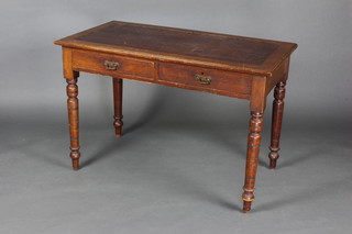 A Victorian rectangular mahogany writing table fitted 2 long drawers raised on turned supports 71cm h x 107cm w x 57cm d (missing inset writing surface) 