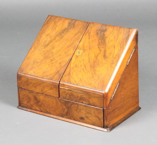 A Victorian walnut wedge shaped stationery box with stepped interior, the base fitted a secret drawer 28cm h x 37cm w x 21cm d 