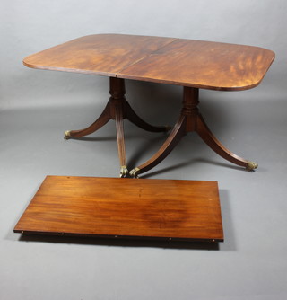 A Georgian style mahogany twin pillar D end extending dining table with 1 extra leaf, raised on turned column and tripod base 74cm h x 42cm w x 149cm l x 208cm when extended 