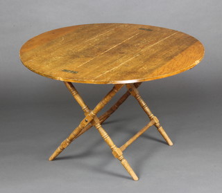 Thornton and Herne, a 19th Century circular pine coaching table raised on turned supports 61cm h x 96cm diam. 
