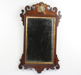 A 19th Century rectangular plate Chippendale style mirror contained in a mahogany frame with phoenix decoration to the top 63cm x 36cm 