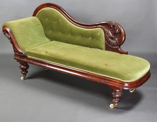 A Victorian mahogany show frame chaise longue upholstered in green buttoned material, raised on turned supports 91cm h x 179cm w x 62cm d  