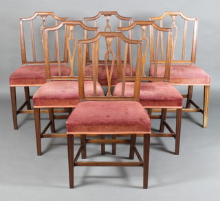 A set of 6 19th Century Georgian style mahogany stick and rail back dining chairs with over stuffed seats raised on square tapering supports with H framed stretcher 