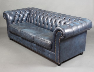 A Chesterfield bed settee upholstered in garter blue buttoned leather 70cm h x 196cm w x 85cm d  