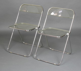 A pair of mid 20th Century Castelli style folding chrome and perspex chairs marked Divisione Sedie 
