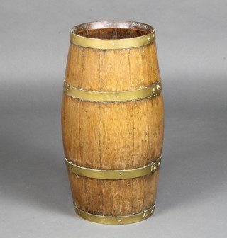 A circular coopered oak barrel stick stand 153cm h x 23cm diam. 