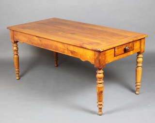 A 19th Century Continental cherry farm house kitchen table, the top formed of 4 planks, fitted a frieze drawer and raised on turned supports 73cm h x 160cm l x 82cm w 
