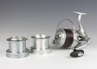 A Penn Surfmaster 850 beach casting fishing reel boxed and with spool, together with instructions 