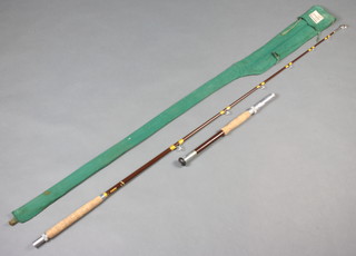 A Hardy Bros. 7' 50lb Class boat fishing rod with detachable butt, contained in a green cloth Shakespeare bag 