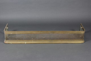 A Victorian pierced brass fender 23cm h x 140cm w x 36cm d 