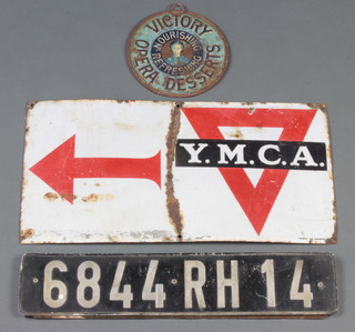 An enamelled YMCA sign 25cm x 50cm (some corrosion), a Victory Opera Desserts tin lid 17cm x 18cm diam. together with a Continental number plate 6844RH14 10cm x 49cm 