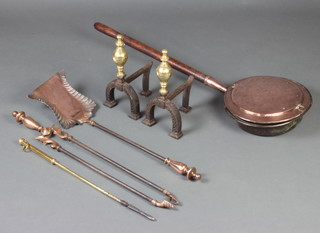 A pair of 19th Century brass and iron fire dogs together with an Art Nouveau copper and iron coal shovel and matching tongs, brass poker and an 18th Century copper warming pan with turned oak handle