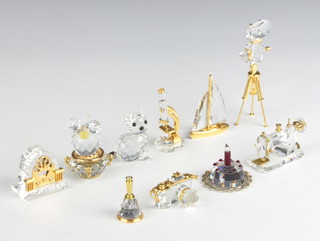 Six Swarovski Classic  models - cactus, radio, sewing machine, film camera, microscope, camera and bell together with 3 crystal figures - cat, yacht and birthday cake, 8 boxed
