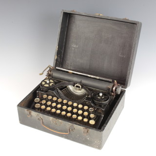 An Underwood portable manual typewriter the reverse marked patent Made in USA other patents pending 26 April 1922 contained in a carrying box 

