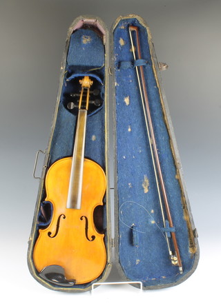 A 19th Century facsimile Antonius Stradivarius violin with 35cm 2 piece back and labelled Antonius Stradivarius Cremonensis Faciebat Anno 1721, together with a bow, the frog inlaid with mother of pearl and contained in a wooden case 