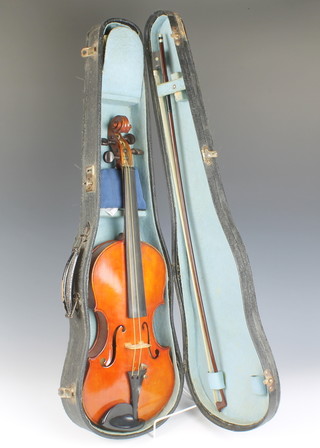 F C Cockman, a violin with 35cm 2 piece back, bearing paper label - F C Cockman London 1912, together with a German bow 