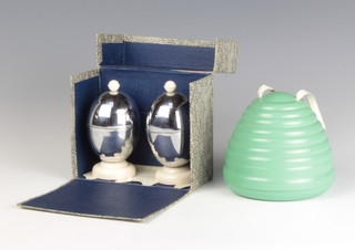 A MB Ware green bakelite beehive wool holder and a pair of Kosy Craft chrome and white bakelite egg cups and covers