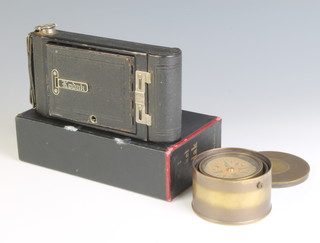 A Kodak No.1 pocket camera boxed together with a reproduction compass contained in a brass gimbal case