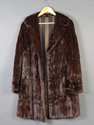 A lady's full length brown mink fur coat