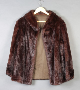 A lady's quarter length mink fur coat by Louis Fine Furs