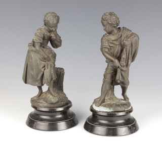 A pair of 19th Century spelter figures of standing fisher boy and girl 20cm h, with associated socle bases 