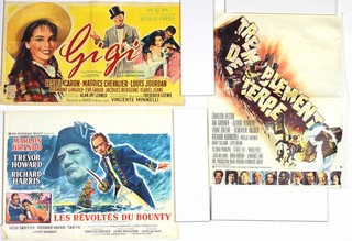 A selection of Belgian movie posters to include (title translated) Gigi 54cm w x 32cm h, The Towering Inferno 32.5cm w x 53cm h, Mutiny on the Bounty 51.5cm w x 37.5cm h, Tara Bulb 64cm w x 45.5cm h, The Omega Man 35.5cm w x 48cm h, 55 Day at Peking 60cm w x 42cm h, Great Locomotive Chase 54.5cm w x 38cm h and An Italian Mutiny on the Bounty 33cm w x 71cm h