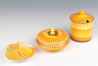An Art Deco Shelley preserve pot and cover with broad orange decoration 11cm, a ditto powder box and cover 7cm and a shell butter dish 11cm 