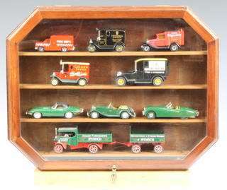 A Dinky Matchbox model of a 1957 series E type jaguar together with 8 other cars contained in a lozenge shaped case 
