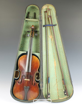 A 19th Century violin with 35cm 2 piece back, bearing label Joseph Guarnerius Fecit Cremonae Anno 17  IHS, together with 3 bows and a wooden carrying case 