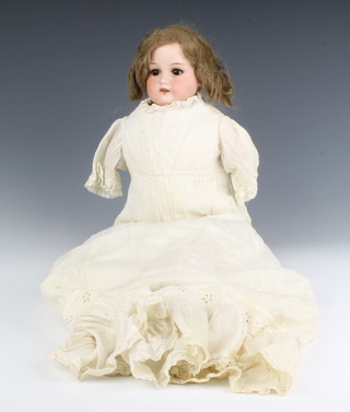 A Victorian Armand Marseille porcelain headed doll with sleep eyes, open mouth with teeth, the shoulders incised 370A.M.ODep Armand Marseille Made in Germany 

