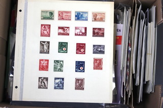 A collection of mint and used world stamps on sheets