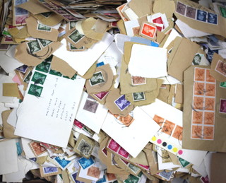 A collection of loose GB stamps mainly on paper 