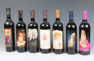 Seven bottles of red wine all decorated with labels bearing images of Marilyn Monroe, comprising a Napa Valley 1995 merlot, ditto 1998, Californian Merlot 2001,  Napa Valley Cabernet Sauvignon 2001, Napa Valley Merlot 2001, ditto Merlot 2002 and a Californian Merlot eighth vintage 2005, together with a leaflet  