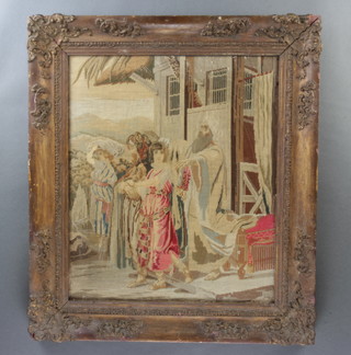 A Victorian woolwork embroidery of a biblical scene with figures before a building 54cm x 45cm 
