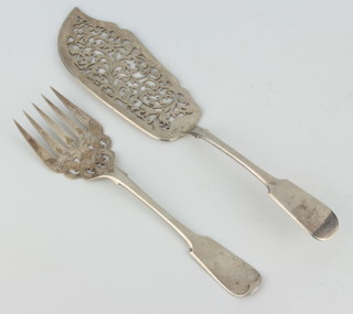 A pair of Victorian pierced silver fish servers with scroll decoration Sheffield 1860 272 grams 