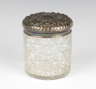 An Edwardian silver topped toilet jar with scroll decoration Sheffield 1903, 8.5cm 