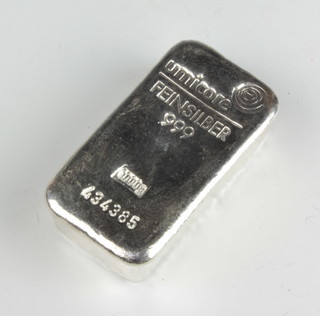 A silver 1000 gram ingot stamped Umicore no. 434385 