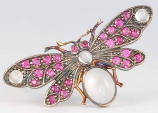 An Edwardian style silver gilt novelty brooch in the form of a moth set with moonstones and rubies 