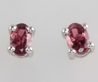 A pair of silver and tourmaline ear studs 1.2ct 